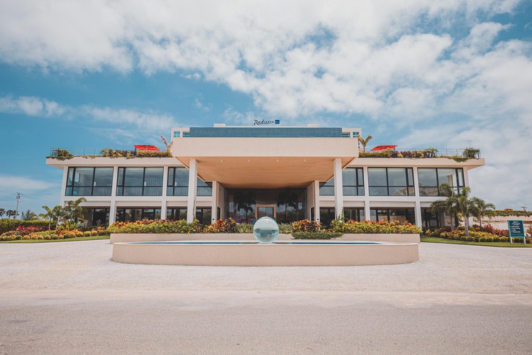 Entrance to the resort with glass ball and blue sky