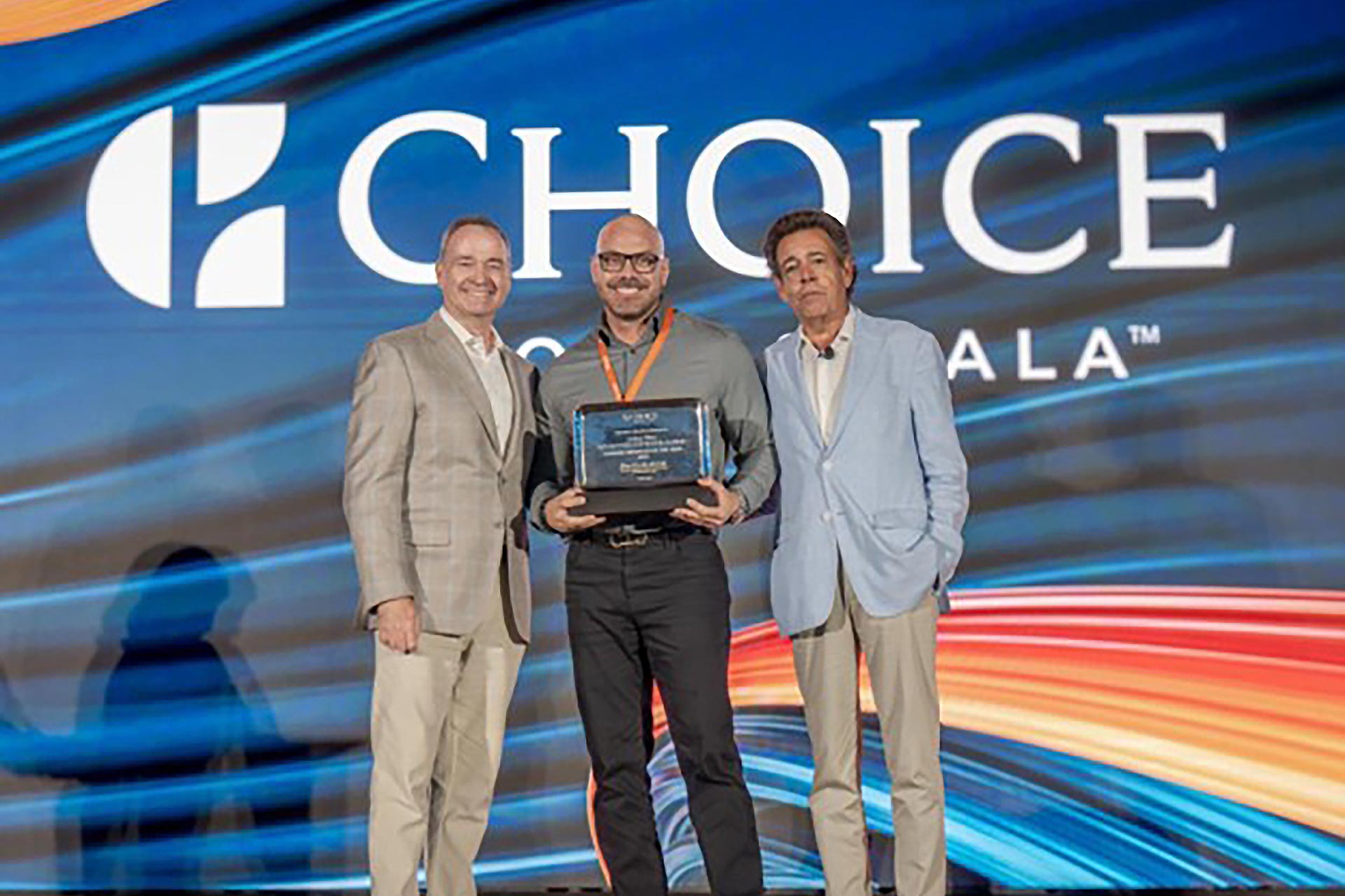 Luigi Wix holding the GM award of the year