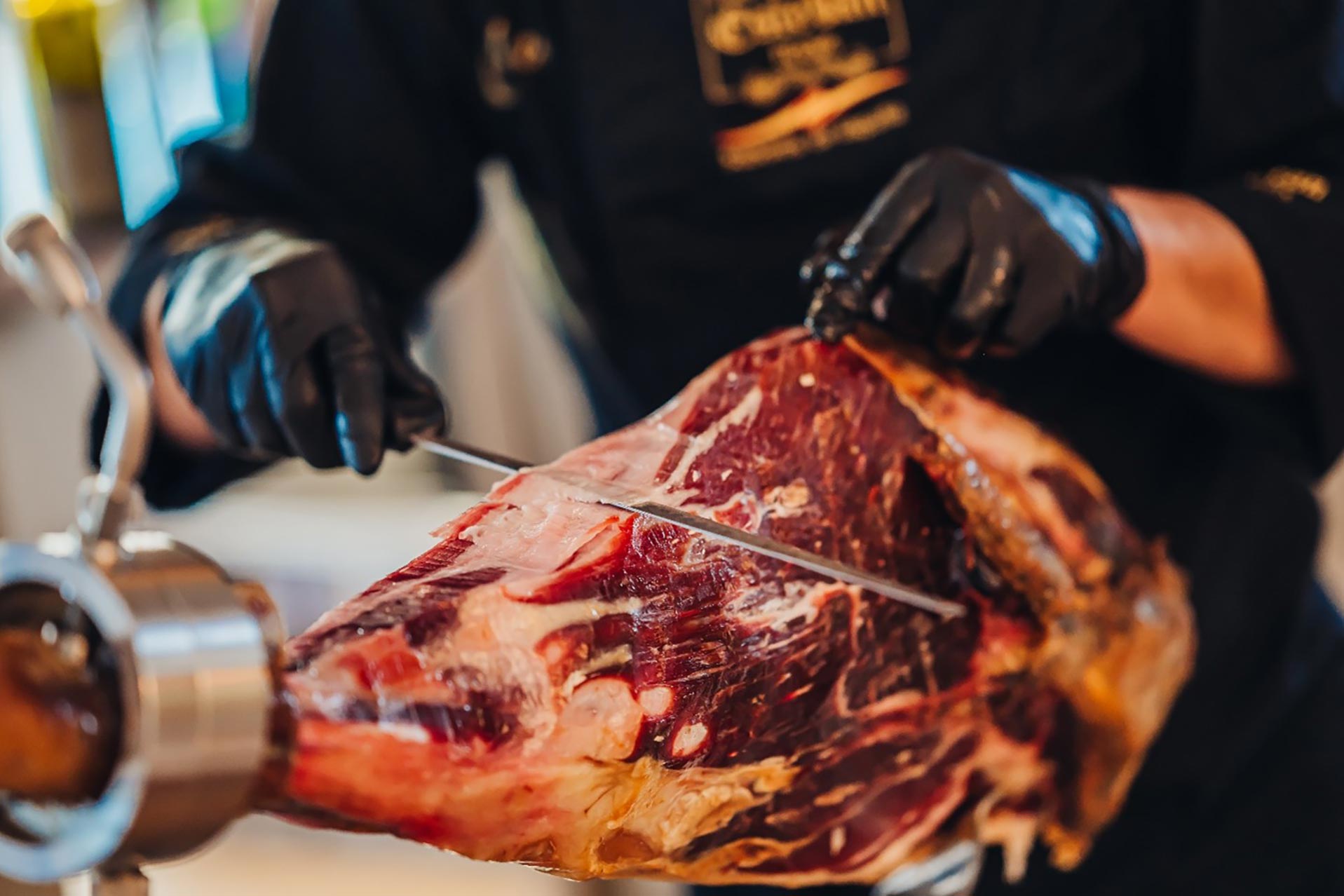 A chef cutting meat